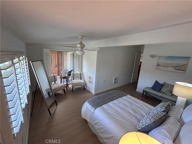 bedroom featuring ceiling fan and dark hardwood / wood-style flooring