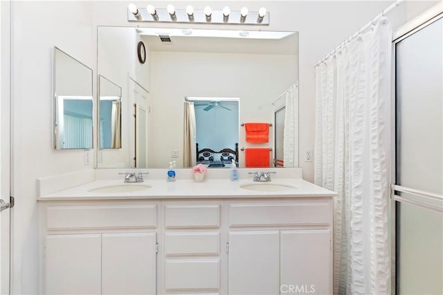 bathroom with a shower with curtain and vanity