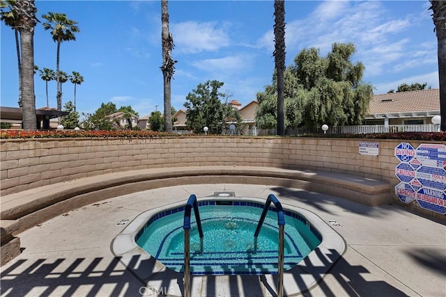 view of pool featuring a hot tub