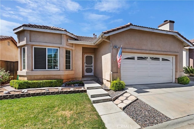 view of front of house with a front yard and a garage