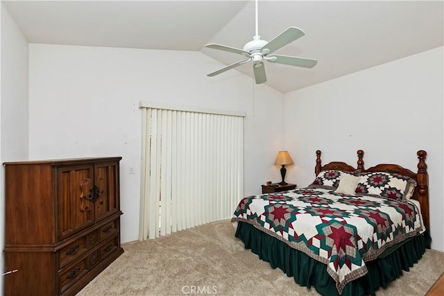 carpeted bedroom featuring vaulted ceiling and ceiling fan