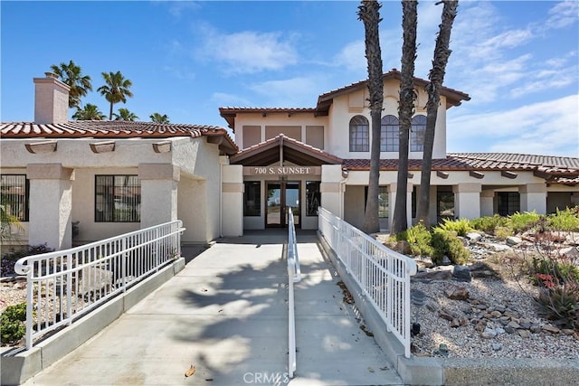 mediterranean / spanish-style house featuring french doors