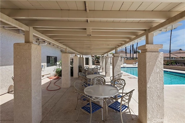 view of patio with a community pool