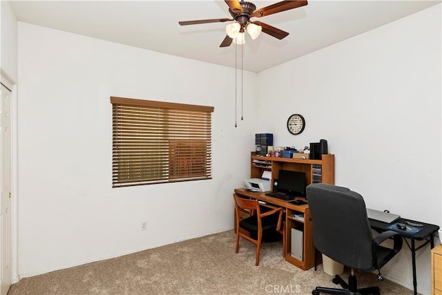 carpeted office featuring ceiling fan