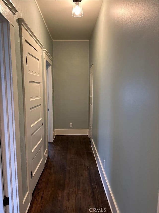 hallway with dark hardwood / wood-style floors