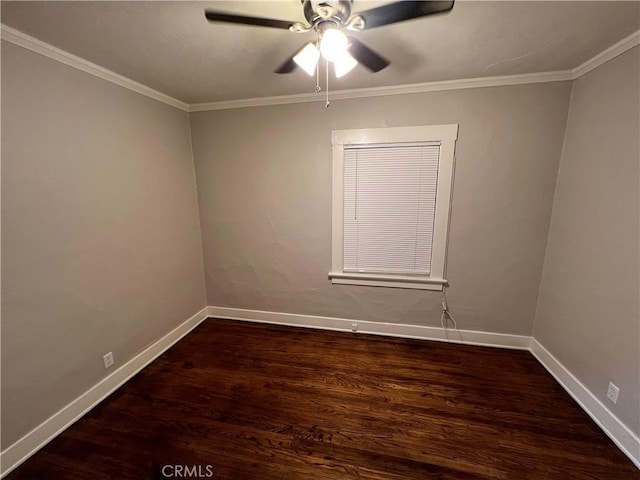 spare room with dark hardwood / wood-style flooring, ceiling fan, and ornamental molding