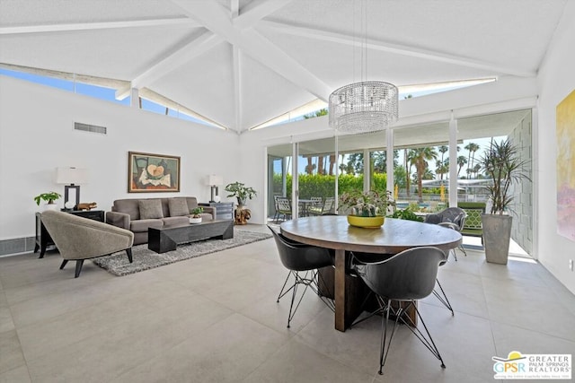 sunroom with vaulted ceiling with beams and an inviting chandelier