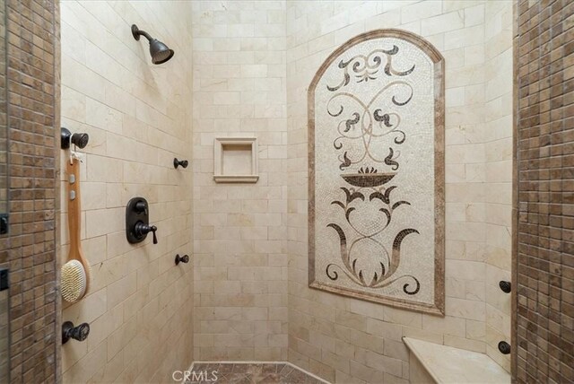 bathroom with tiled shower