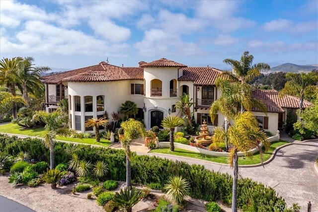 mediterranean / spanish home featuring a mountain view