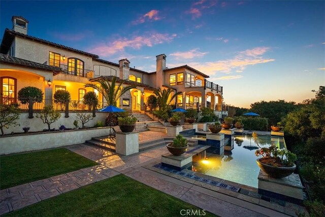 exterior space with a patio area and a balcony