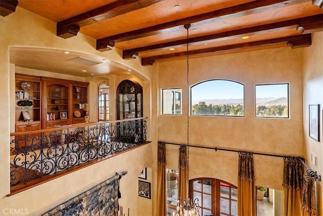 interior space with french doors and beamed ceiling