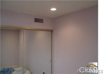 unfurnished bedroom with a closet