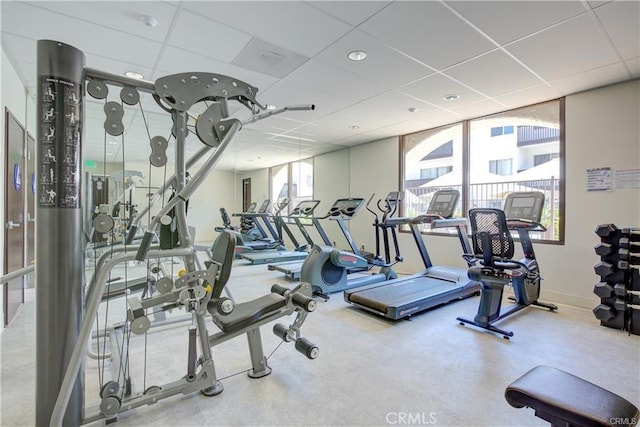 workout area with a paneled ceiling