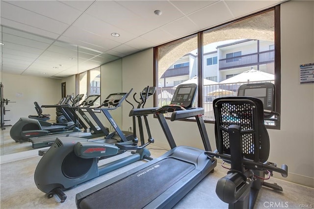 workout area featuring a drop ceiling