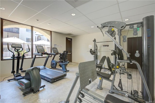 exercise room with a drop ceiling