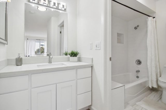 full bathroom featuring vanity, shower / bathtub combination with curtain, and toilet