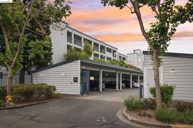 view of outdoor building at dusk