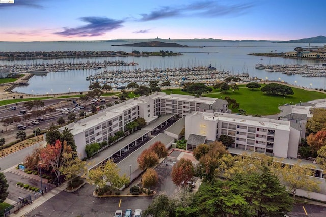 aerial view at dusk with a water view