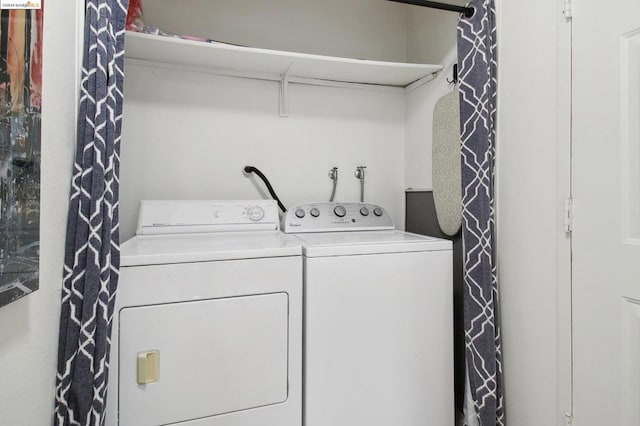 laundry area with washing machine and clothes dryer