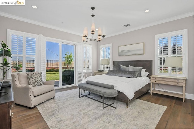 bedroom featuring access to exterior, a chandelier, dark wood-type flooring, and ornamental molding