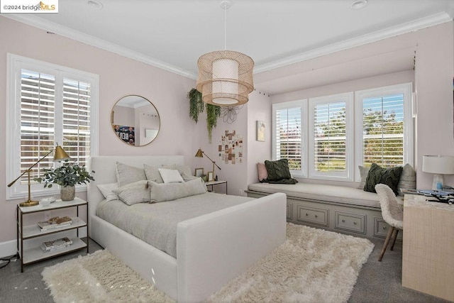 carpeted bedroom with ornamental molding