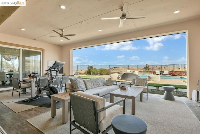 view of patio / terrace with a fenced in pool and an outdoor hangout area