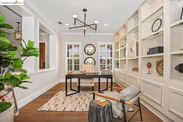 home office featuring an inviting chandelier, ornamental molding, and hardwood / wood-style flooring