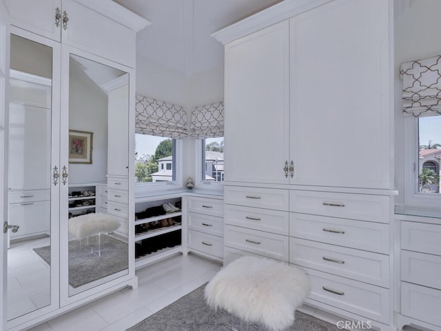 spacious closet featuring light tile patterned floors