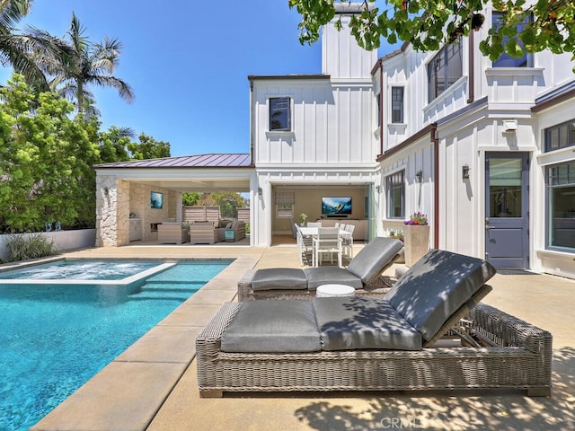 view of swimming pool featuring a patio area