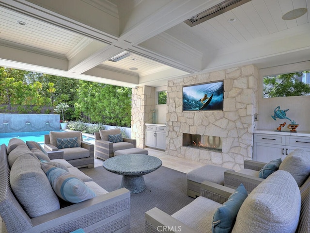 view of patio featuring an outdoor living space with a fireplace