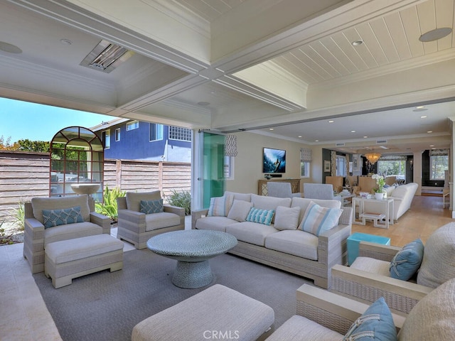 living room featuring beamed ceiling, light hardwood / wood-style floors, ornamental molding, and coffered ceiling