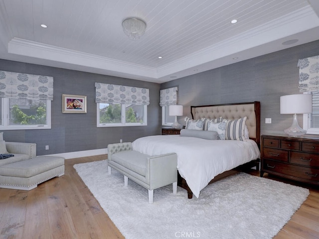 bedroom featuring a tray ceiling, wooden ceiling, and light hardwood / wood-style floors