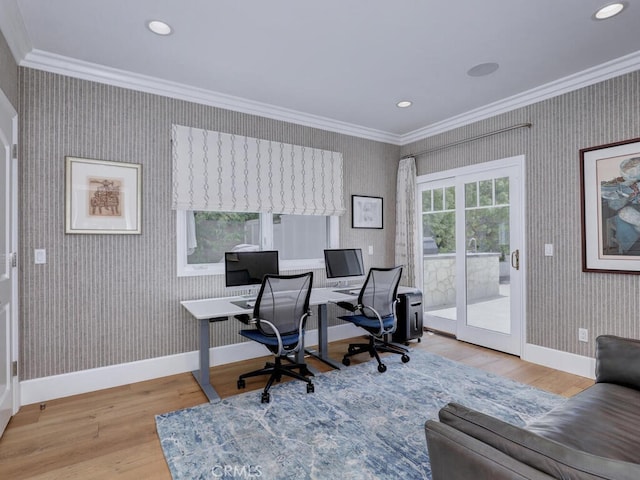 office area featuring light hardwood / wood-style flooring and crown molding