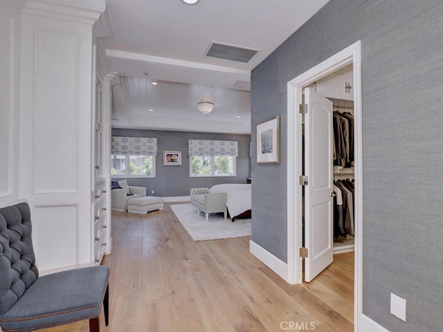 corridor with light hardwood / wood-style flooring