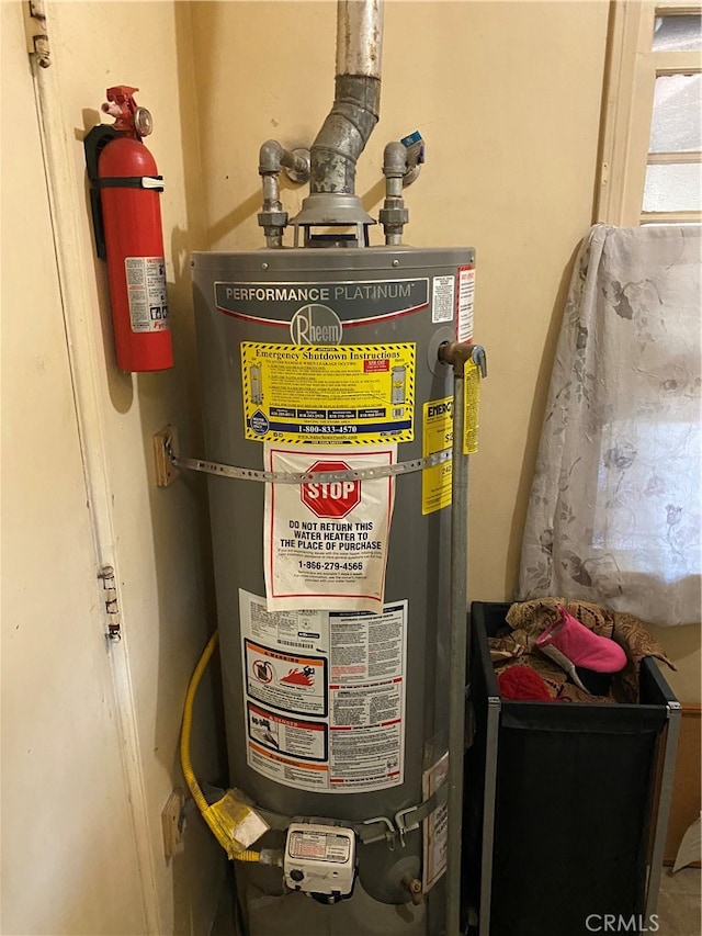 utility room with water heater