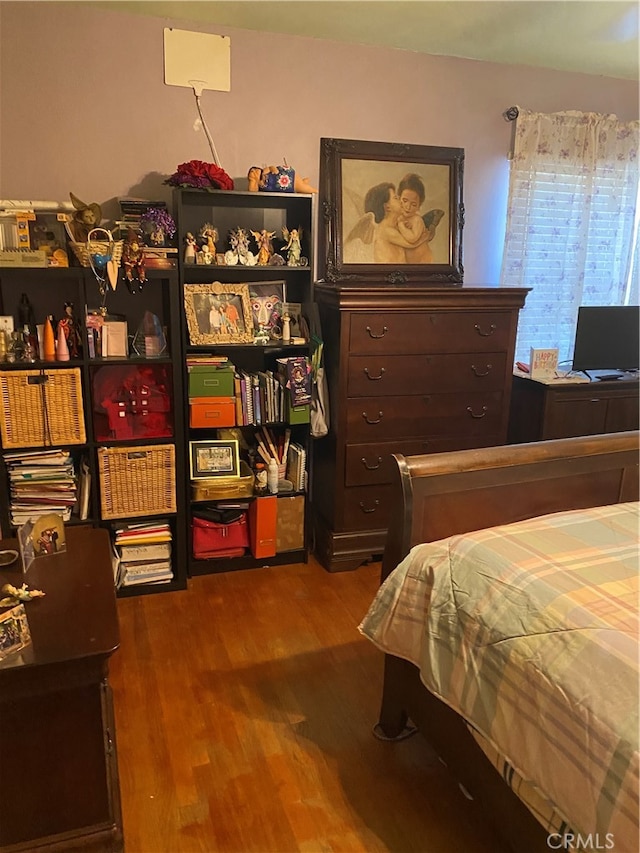 bedroom with wood-type flooring