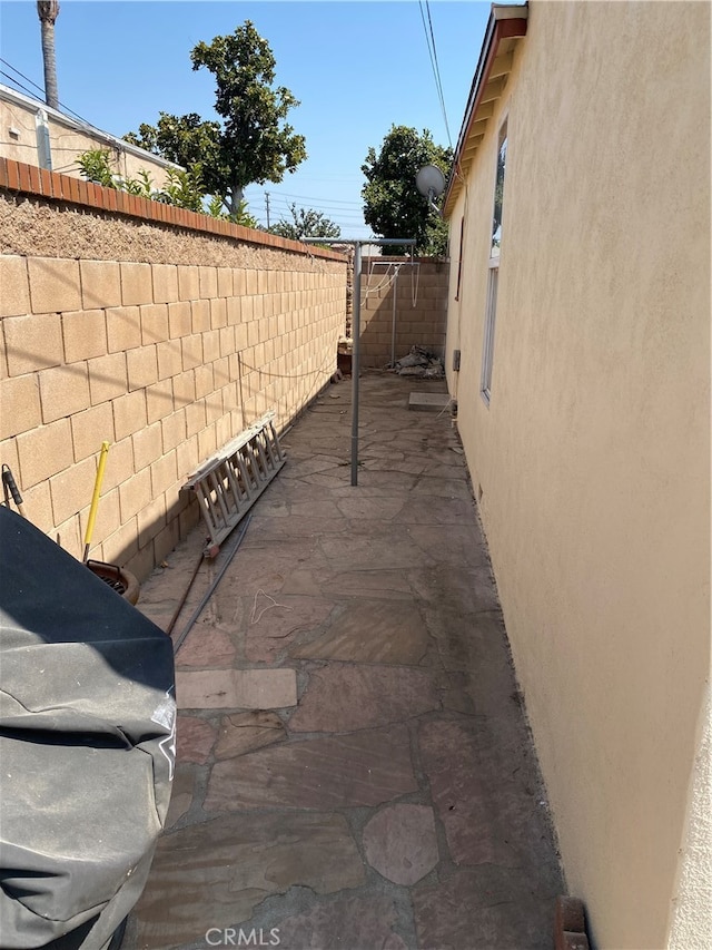 view of side of home with a patio