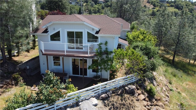 view of front of house with a balcony