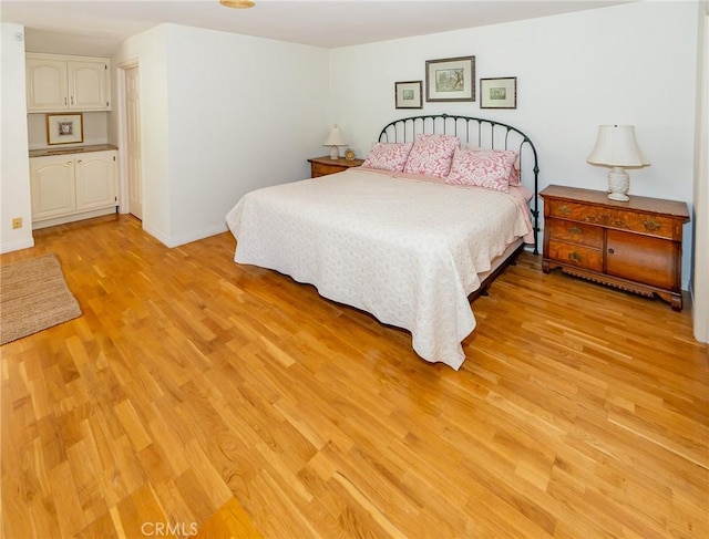 bedroom with light wood-type flooring