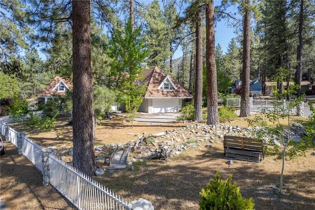 view of yard with a garage and an outdoor structure