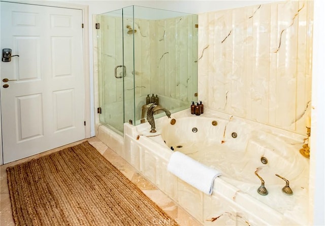 bathroom featuring tile patterned floors and separate shower and tub