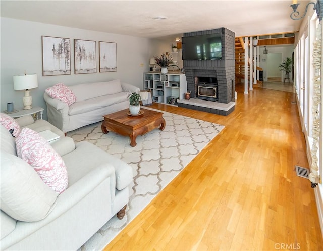 living room featuring a fireplace and hardwood / wood-style flooring