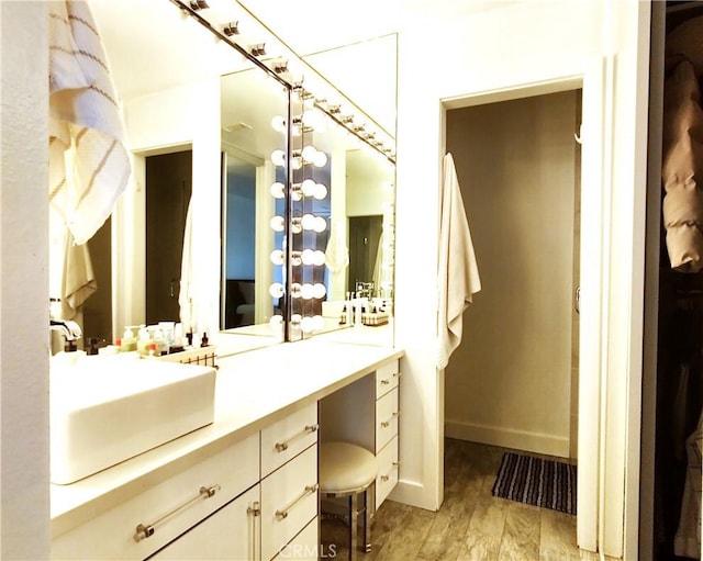 bathroom featuring wood-type flooring and vanity