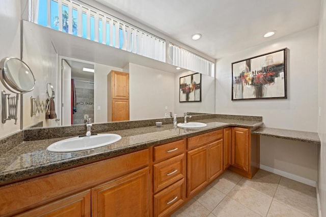 bathroom featuring vanity, tile patterned floors, and a shower with door