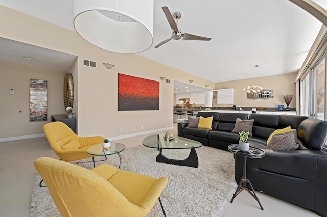 living room featuring ceiling fan with notable chandelier