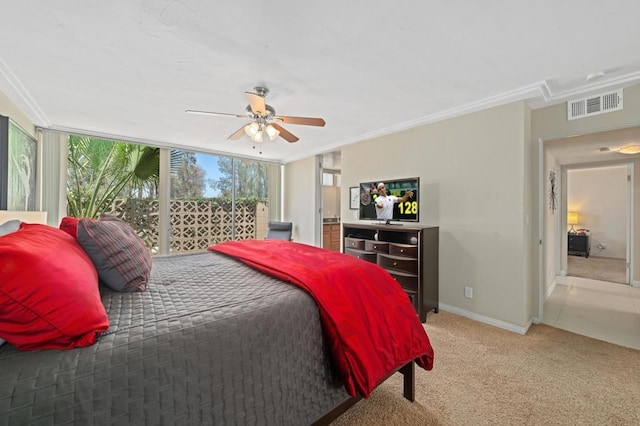 bedroom with light colored carpet, ceiling fan, and crown molding