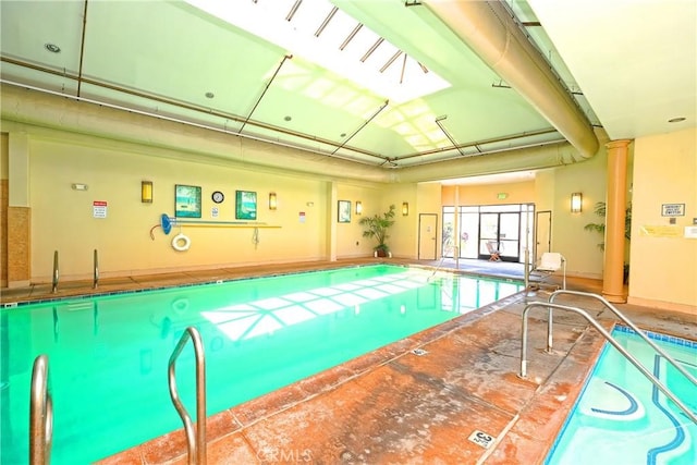 view of pool with ornate columns