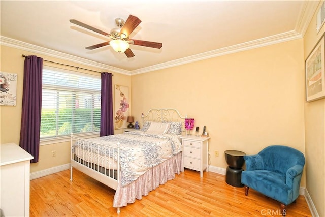 bedroom featuring ceiling fan, crown molding, and light hardwood / wood-style floors