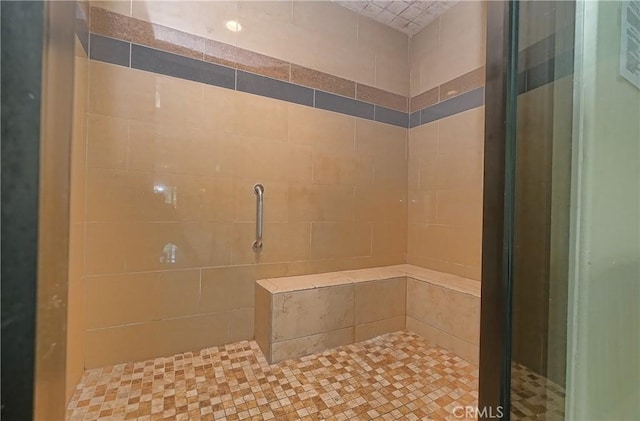 bathroom featuring tiled shower