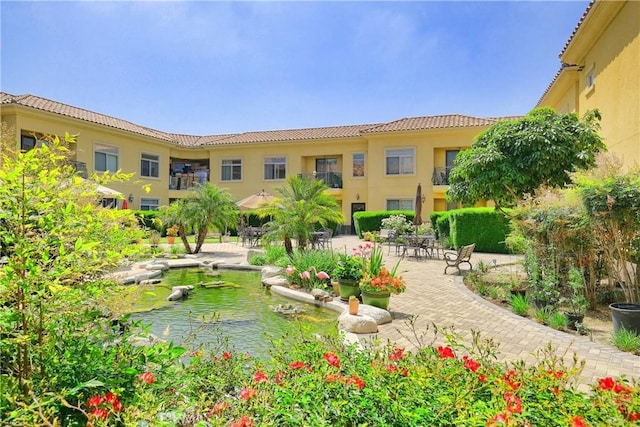 view of home's community featuring a patio